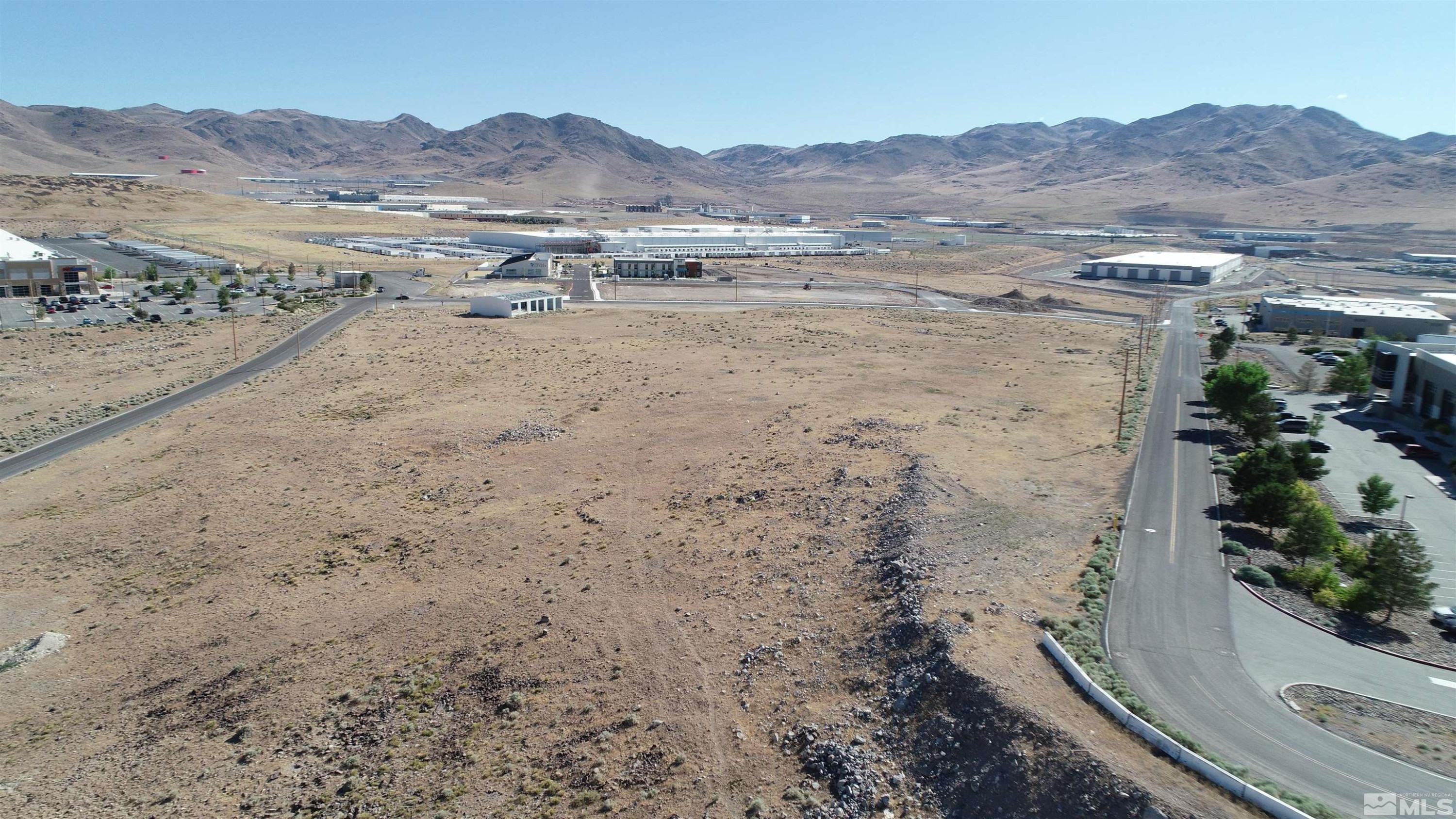 1333 Venice Drive Sparks, NV 89437 - Photo 11 of 40 a view of a dry field with mountains in the background