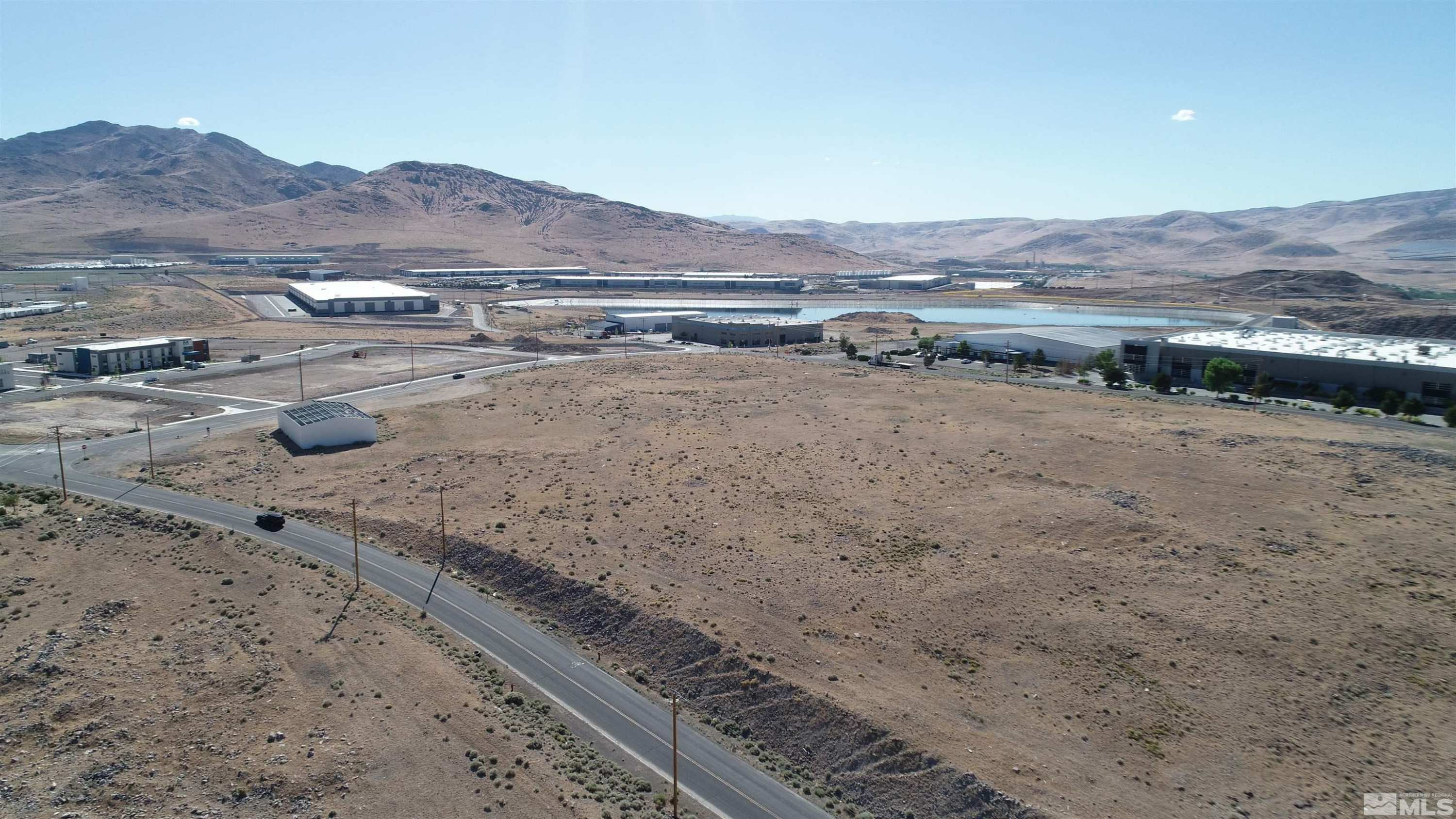 1333 Venice Drive Sparks, NV 89437 - Photo 4 of 40 a view of a dry yard with mountains in the background