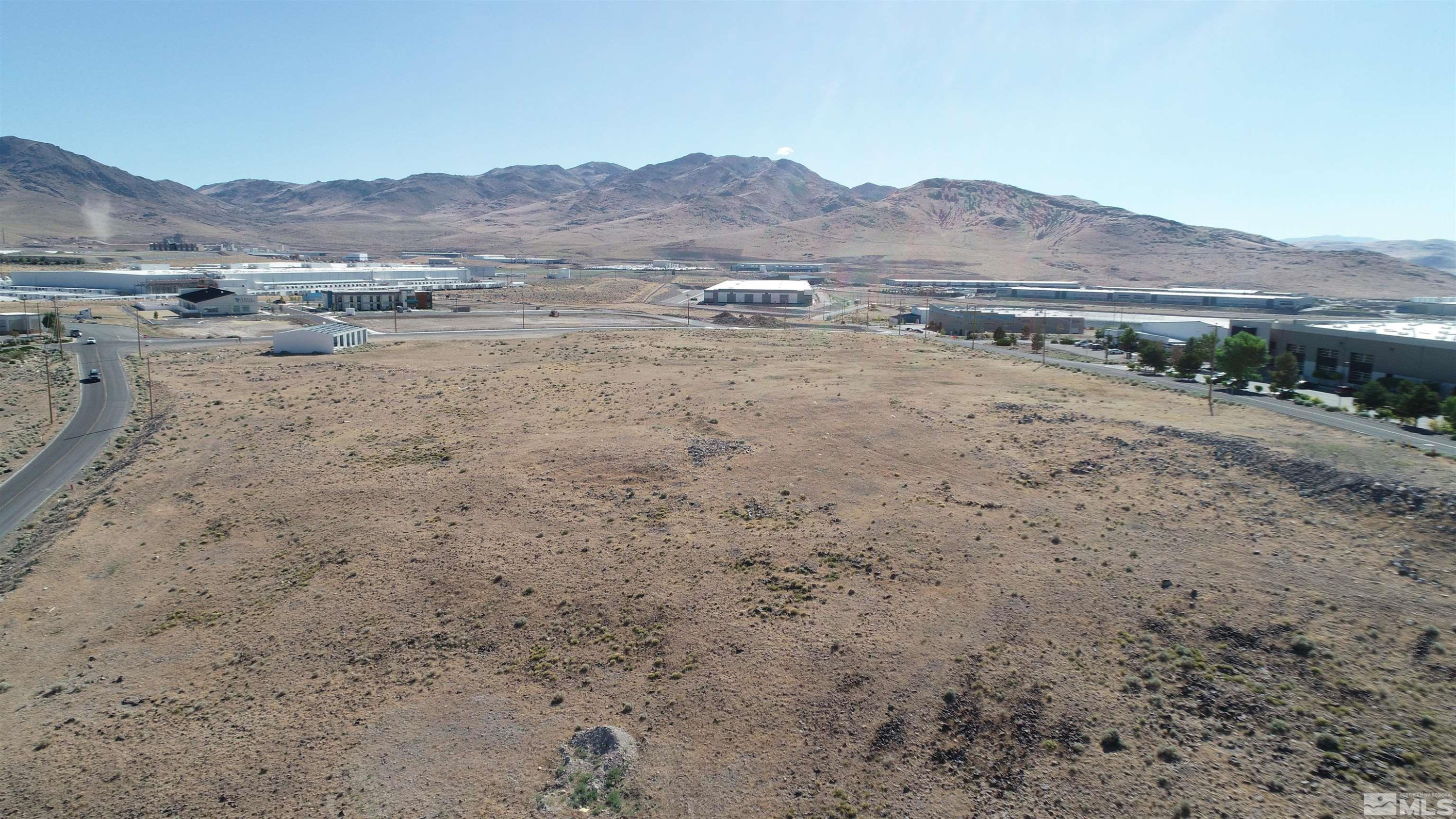 1333 Venice Drive Sparks, NV 89437 - Photo 6 of 40 a view of a dry field with mountains in the background