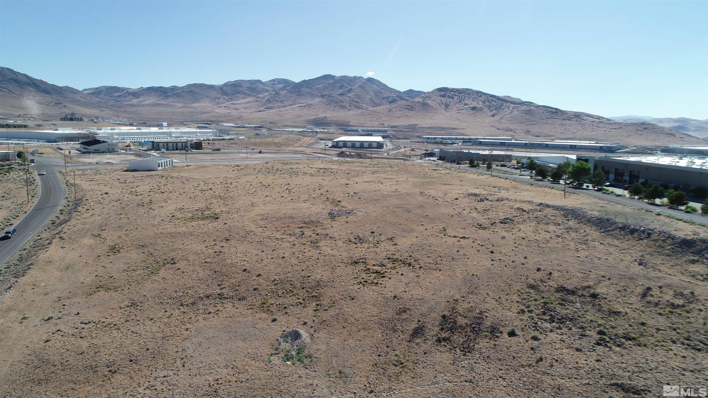 1333 Venice Drive Sparks, NV 89437 - Photo 7 of 40 a view of a dry field with mountains in the background