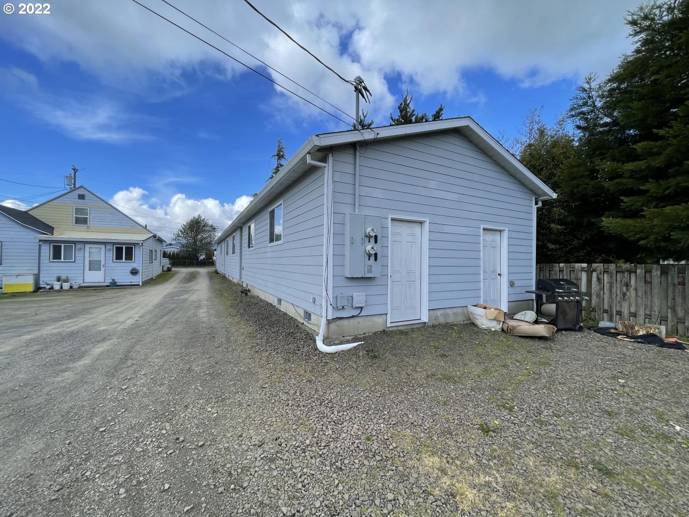 3413 Maple Lane Tillamook, OR 97141 - Photo 21 of 32 a view of a house with wooden fence