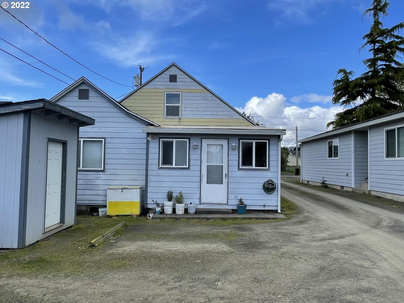 3413 Maple Lane Tillamook, OR 97141 - Photo 22 of 32 a view of a house with a yard