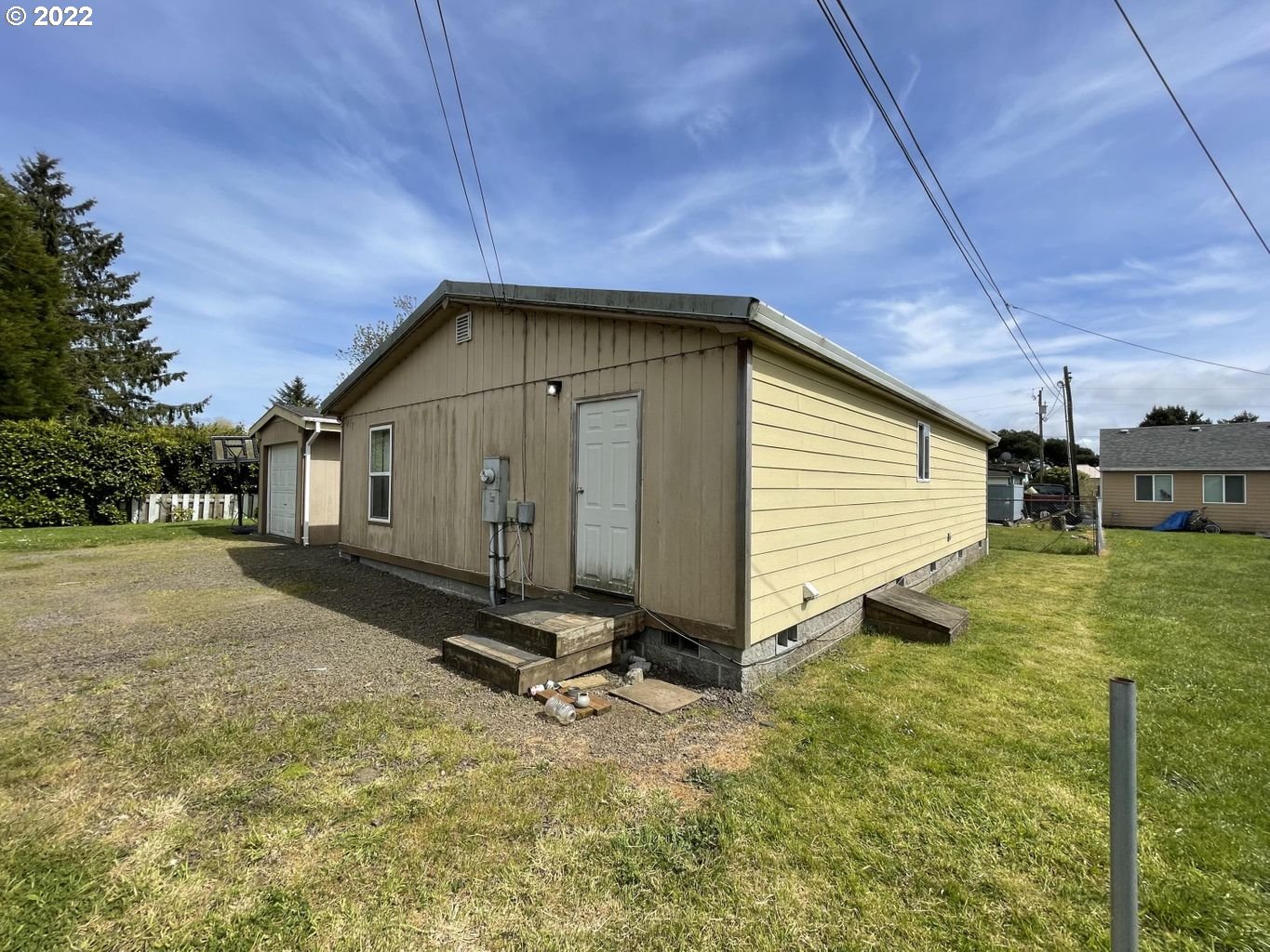 3413 Maple Lane Tillamook, OR 97141 - Photo 25 of 32 a view of a house with backyard and garden