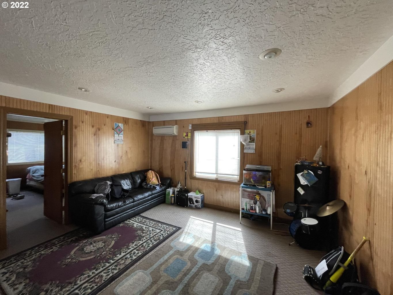 3413 Maple Lane Tillamook, OR 97141 - Photo 28 of 32 a living room with furniture window and gym equipment
