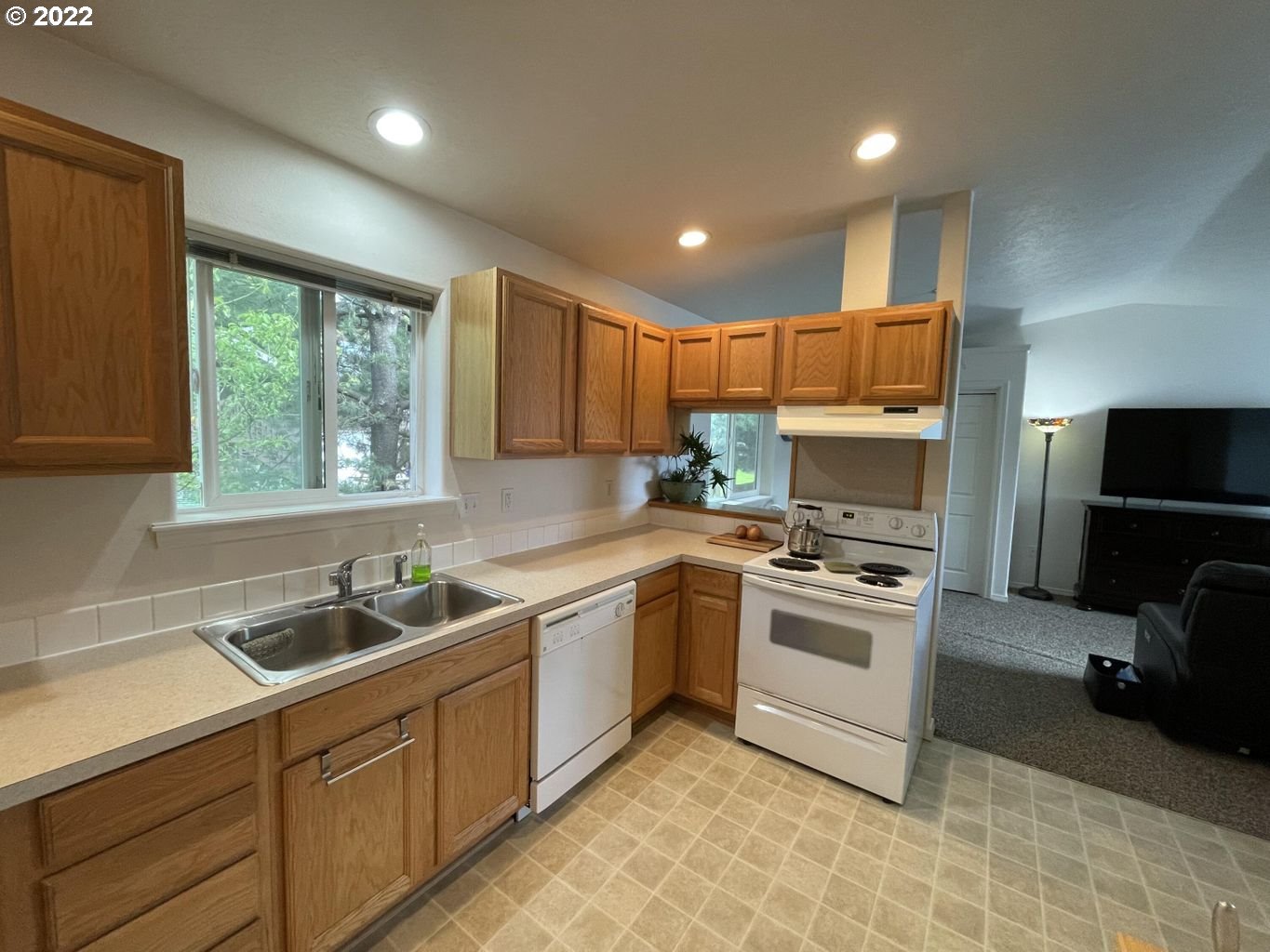 3413 Maple Lane Tillamook, OR 97141 - Photo 3 of 32 a kitchen with a sink stove and microwave