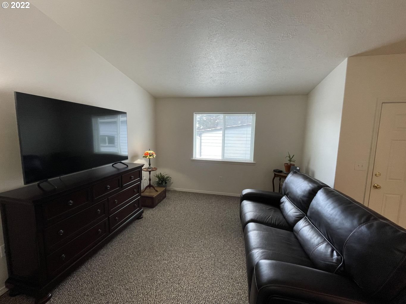 3413 Maple Lane Tillamook, OR 97141 - Photo 4 of 32 a living room with furniture and a flat screen tv