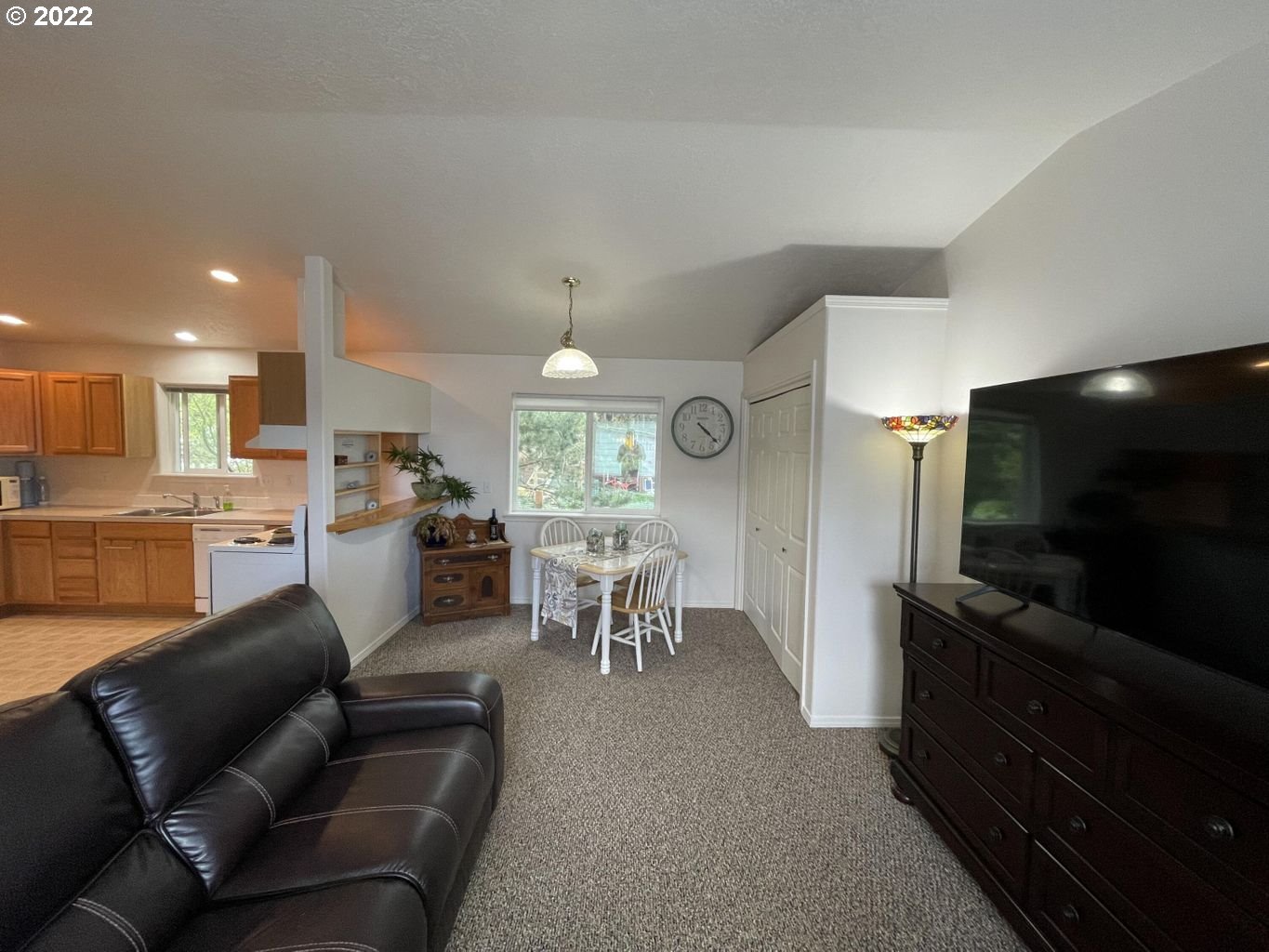 3413 Maple Lane Tillamook, OR 97141 - Photo 6 of 32 a living room with furniture and a flat screen tv