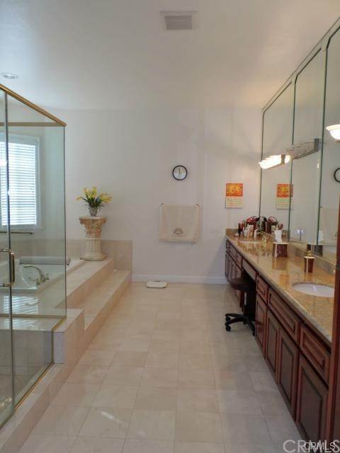 3068 Windmill Drive Diamond Bar, CA 91765 - Photo 14 of 35 a bathroom with a tub sink and mirror