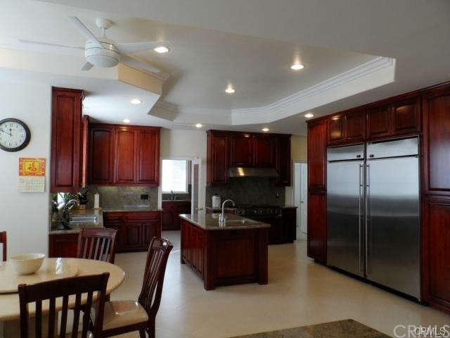 3068 Windmill Drive Diamond Bar, CA 91765 - Photo 25 of 35 a kitchen with a refrigerator and a dining table