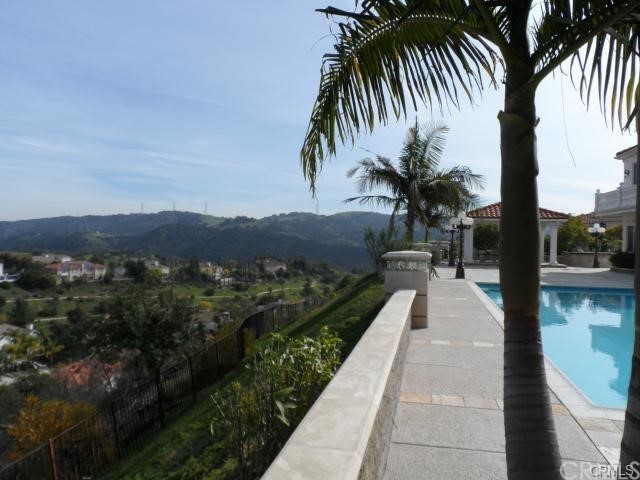 3068 Windmill Drive Diamond Bar, CA 91765 - Photo 31 of 35 a view of a balcony with a yard and palm trees