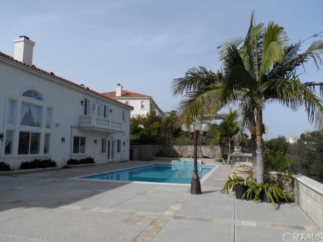 3068 Windmill Drive Diamond Bar, CA 91765 - Photo 34 of 35 a view of a street with potted plants and palm trees