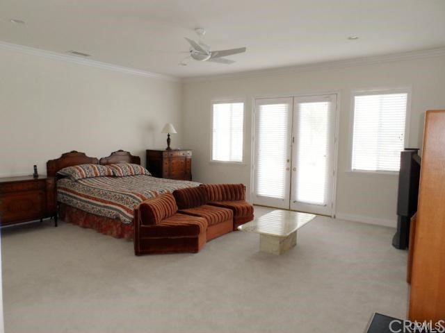 3068 Windmill Drive Diamond Bar, CA 91765 - Photo 10 of 35 a bedroom with a bed and a chandelier
