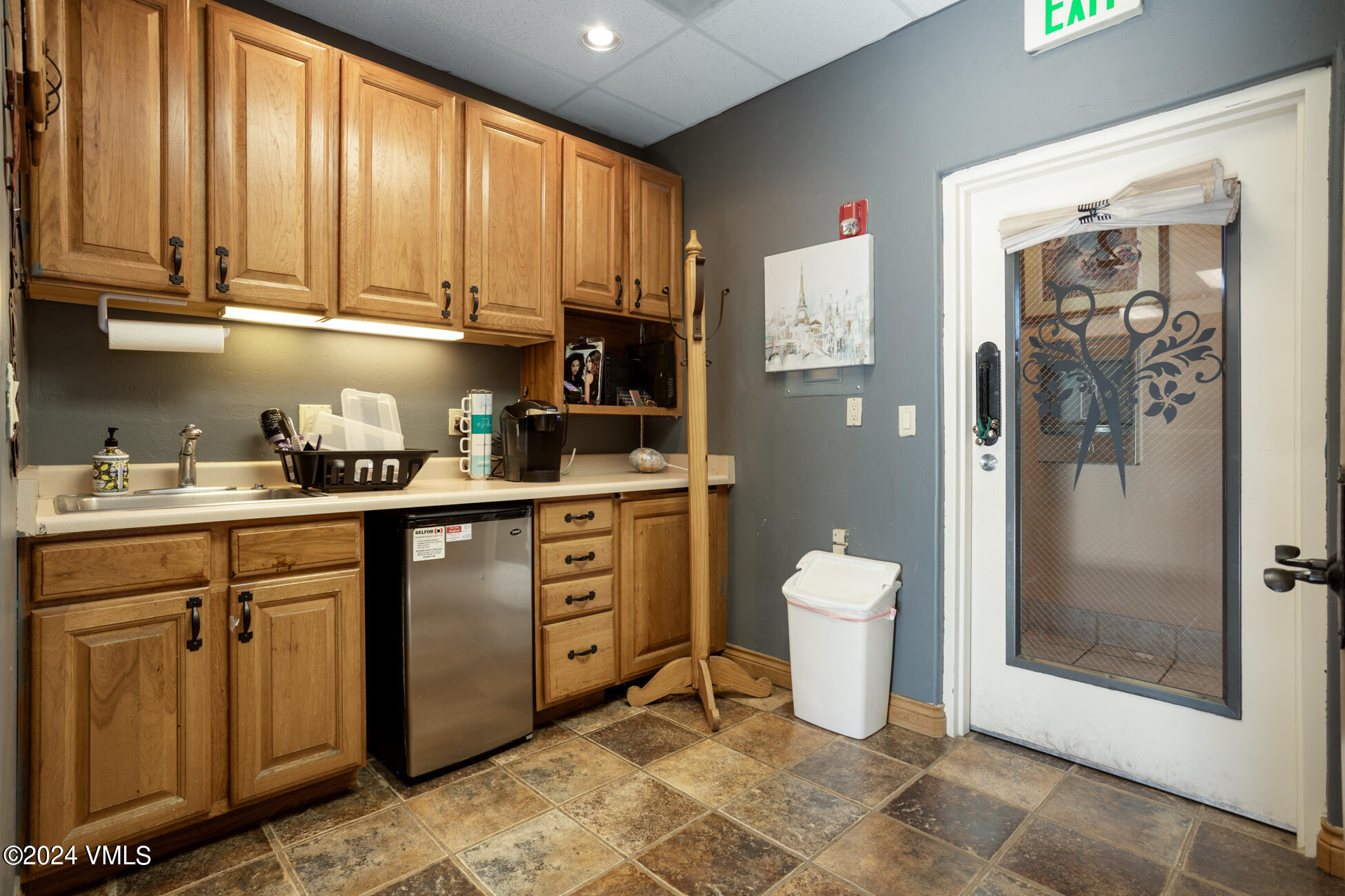 105 Capitol Street, Unit 1 2 3 4 5 6 7 8 Eagle, CO 81631 - Photo 19 of 31 a kitchen with a refrigerator a sink and cabinets