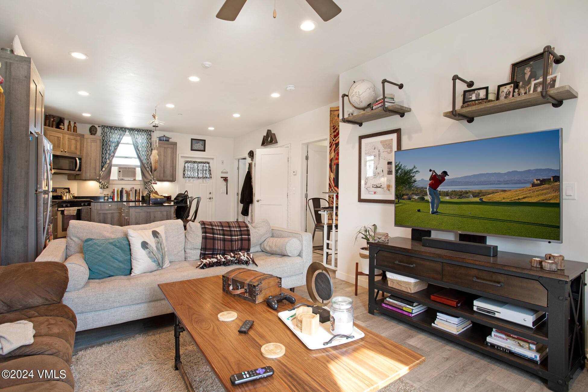105 Capitol Street, Unit 1 2 3 4 5 6 7 8 Eagle, CO 81631 - Photo 25 of 31 a living room with furniture and a flat screen tv