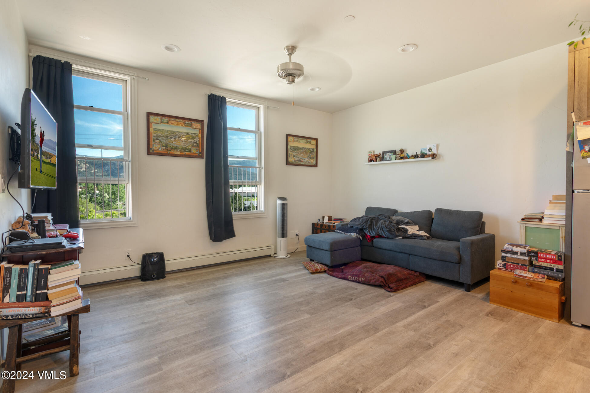 105 Capitol Street, Unit 1 2 3 4 5 6 7 8 Eagle, CO 81631 - Photo 28 of 31 a living room with furniture and a flat screen tv