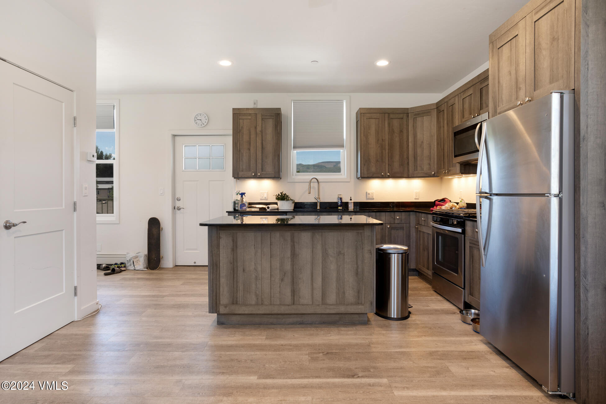 105 Capitol Street, Unit 1 2 3 4 5 6 7 8 Eagle, CO 81631 - Photo 31 of 31 a kitchen with stainless steel appliances granite countertop a refrigerator a sink a stove and a refrigerator