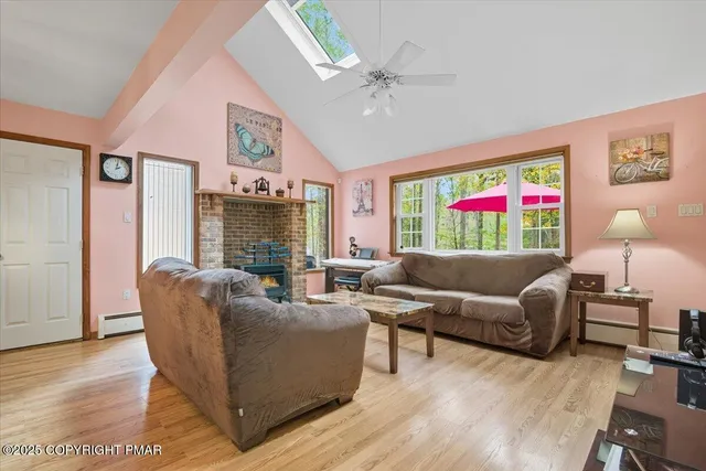 a view of a dining room with furniture wooden floor and chandelier