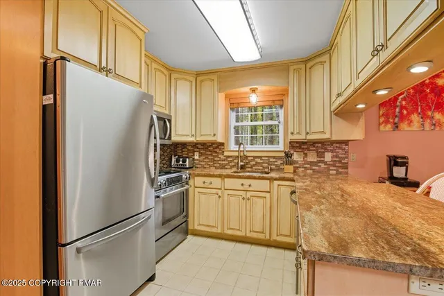 a bedroom that has a bed and a chandelier