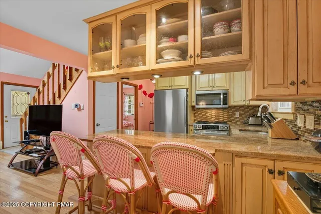 a bed sitting in a bedroom with a flat screen tv and a bed