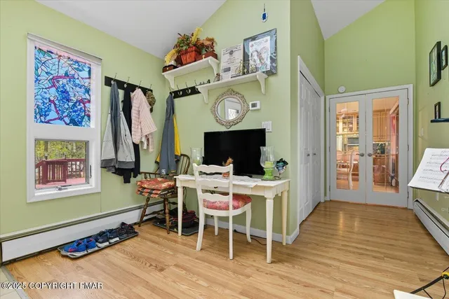 a view of a chairs and table in the balcony