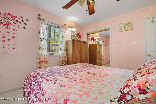 a view of a chairs and table in the back yard of the house