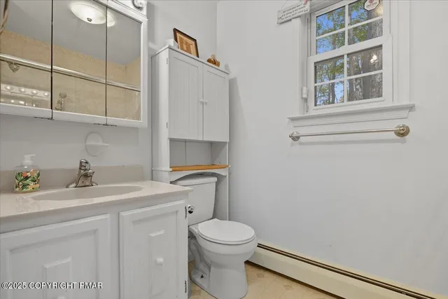 a view of a patio with a table and chairs