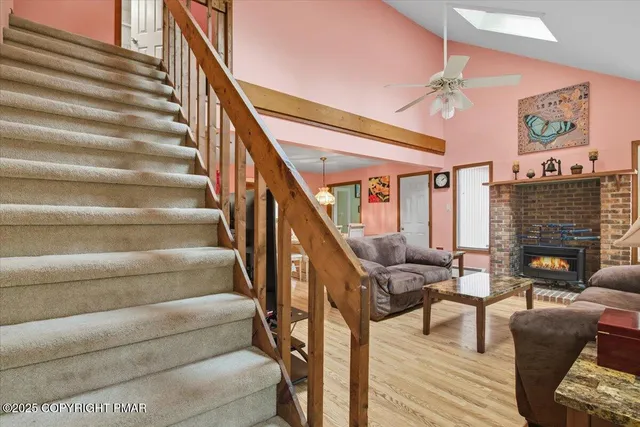 an aerial view of a house with a yard and street