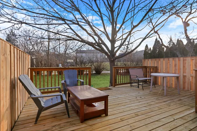a view of a house with wooden deck