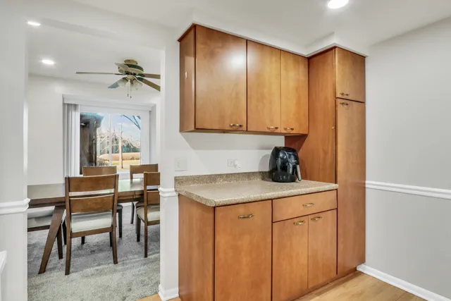 a view of a hallway with furniture