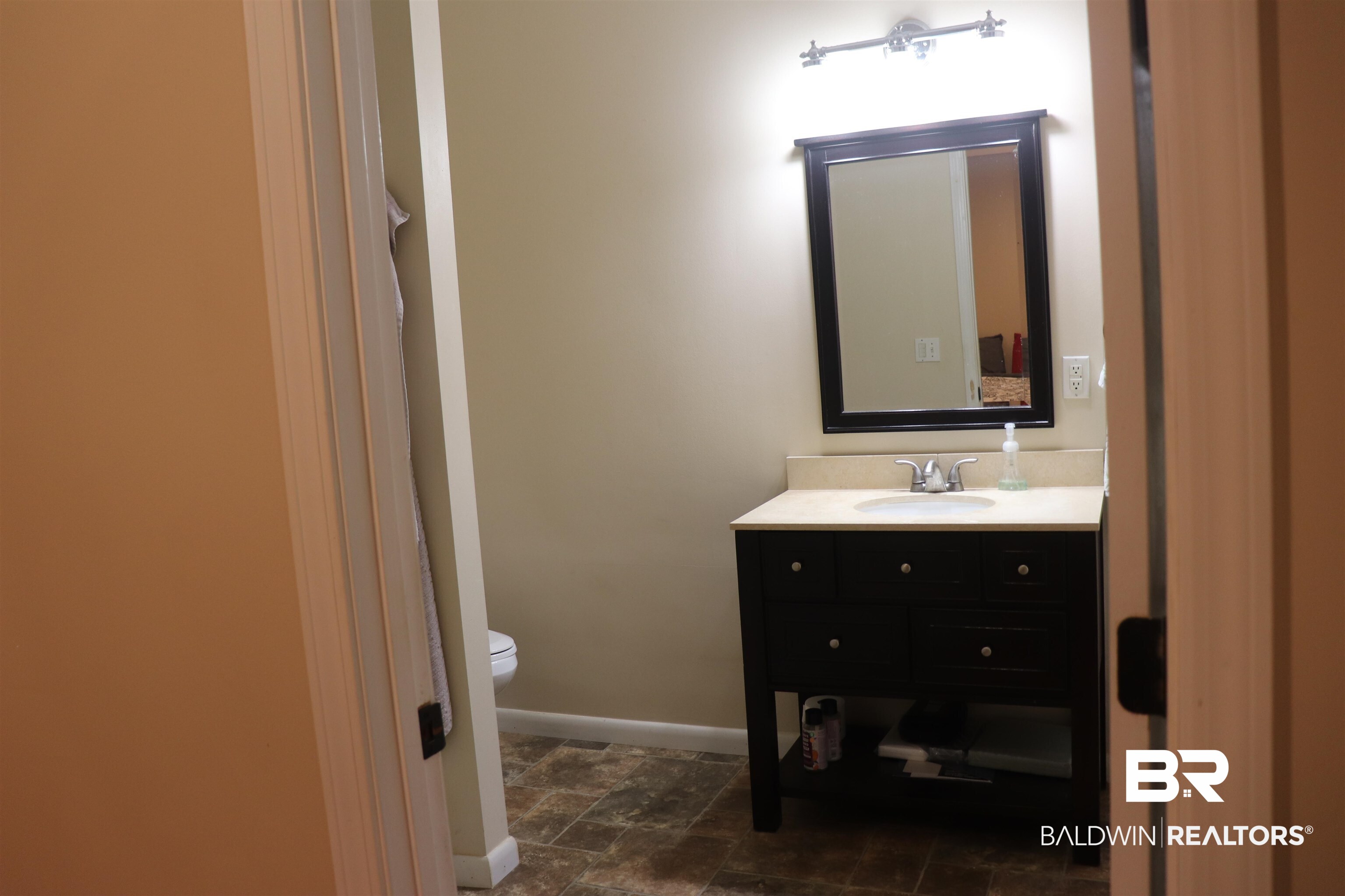 102 Brown Road Evergreen, AL 36401 - Photo 11 of 26 Bathroom with vanity and stone finish floors
