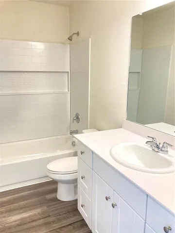 a bathroom with a sink a toilet and a bathtub