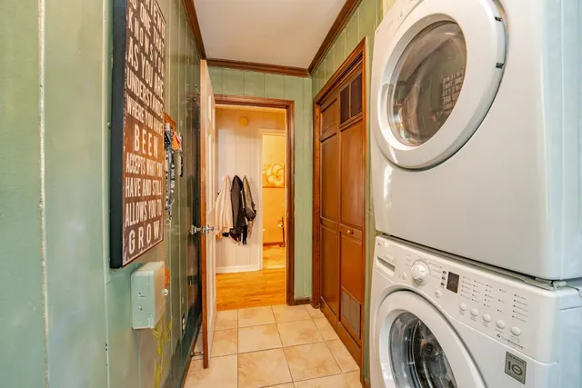 a view of a storage & utility room with dryer and washer