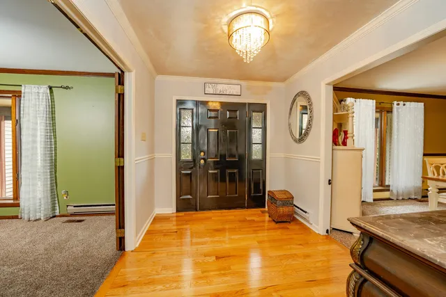 a bed room with a bed and a mirror