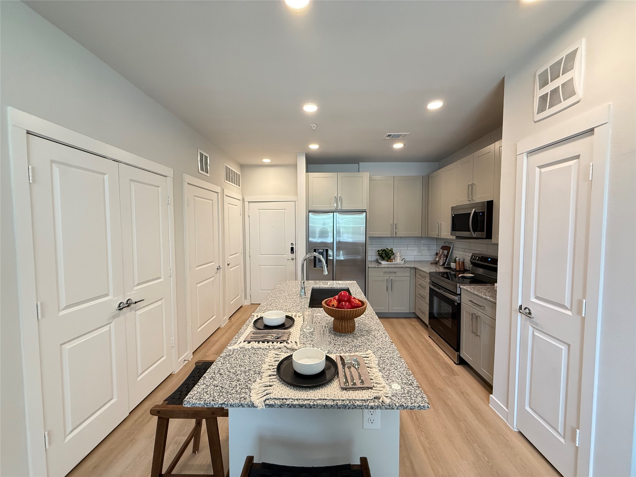 1610 Campbell Road, Unit A1 275 Houston, TX 77055 - Photo 2 of 11 a kitchen with sink refrigerator and stove