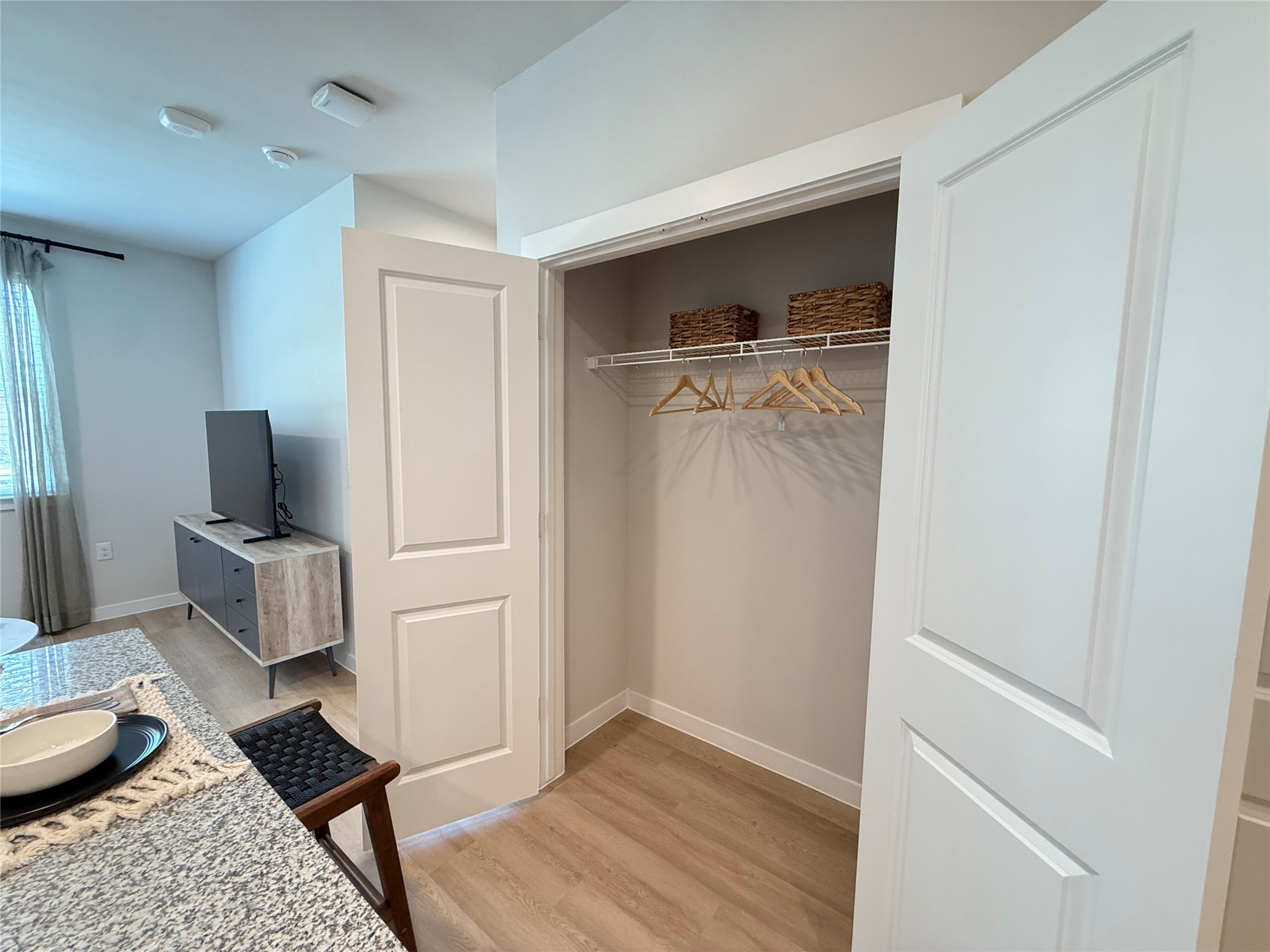 1610 Campbell Road, Unit A1 275 Houston, TX 77055 - Photo 11 of 11 a room with a chair and wooden floor