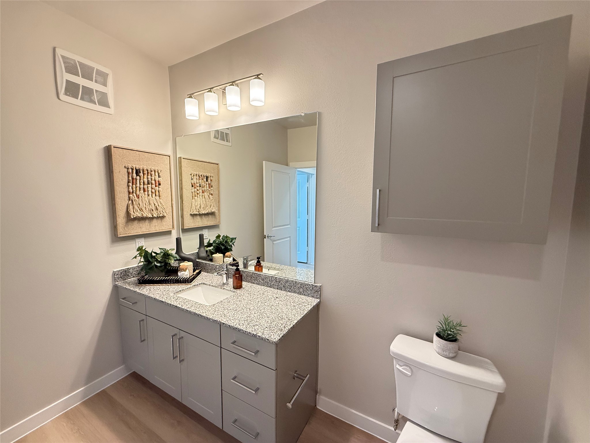 1610 Campbell Road, Unit A1 275 Houston, TX 77055 - Photo 8 of 11 a bathroom with a sink and a mirror