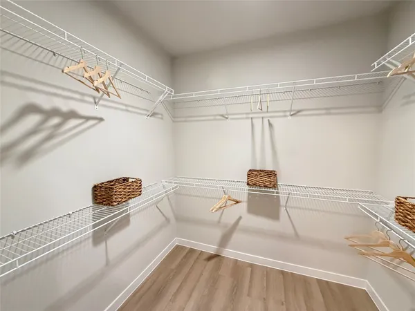 a room with a chair and wooden floor