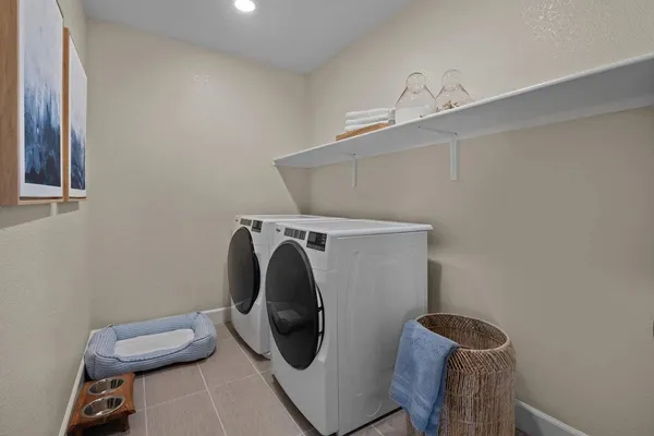 a utility room with dryer and washer