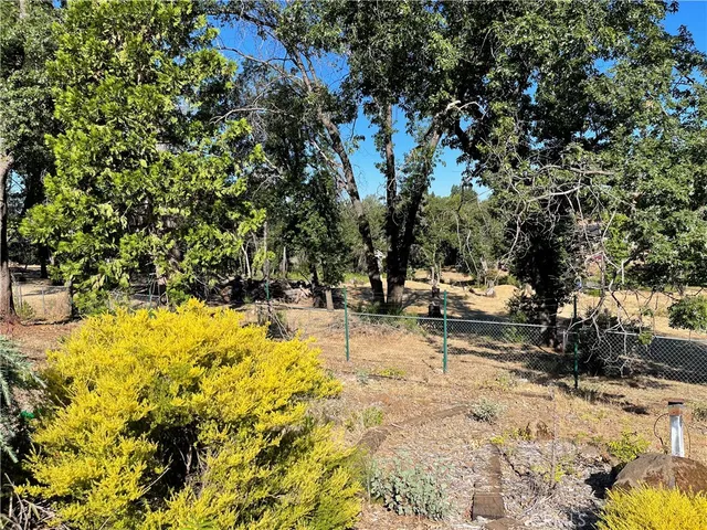 a view of yard with swimming pool and sitting area