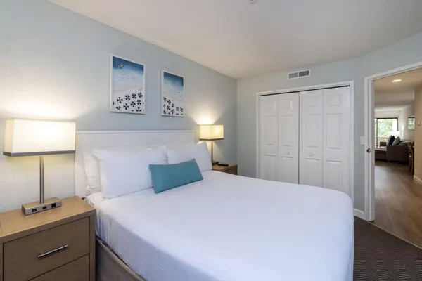 a bathroom with a sink shower and a mirror