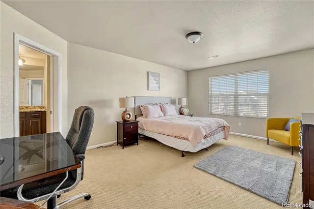 a bedroom with a bed and furniture