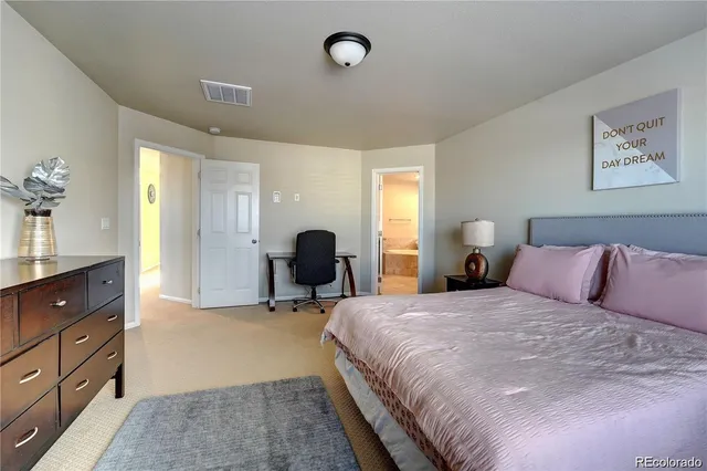 a bathroom with a granite countertop sink a large mirror and a bathtub