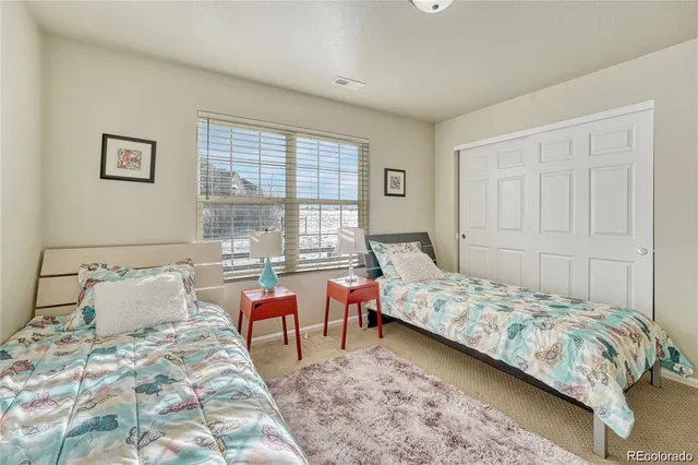 a bathroom with a sink a toilet a mirror and shower