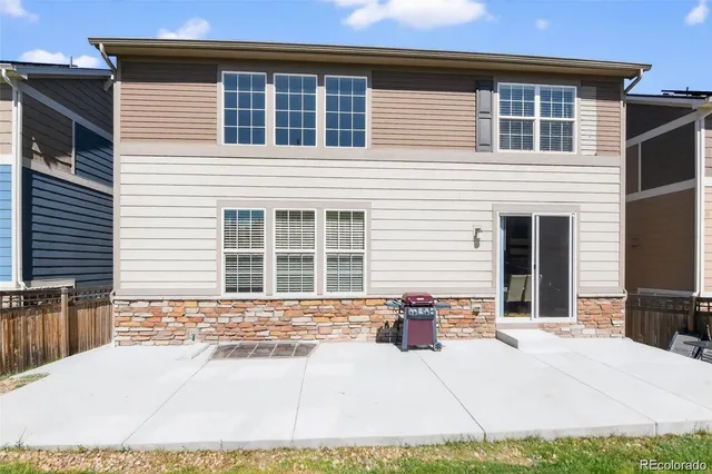 a view of a patio with a table and chairs