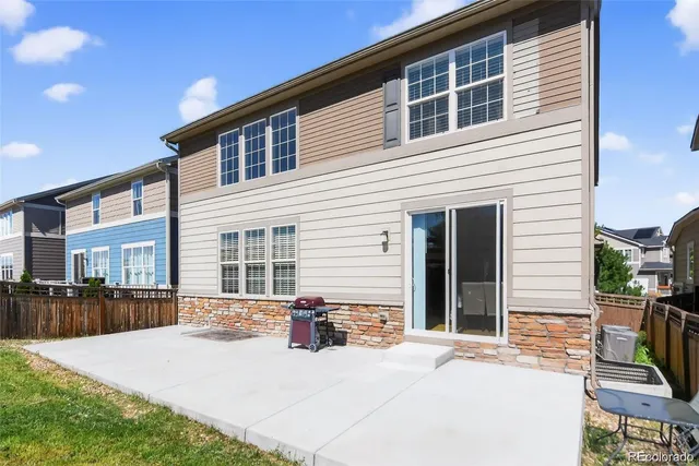 a view of a patio with a table and chairs