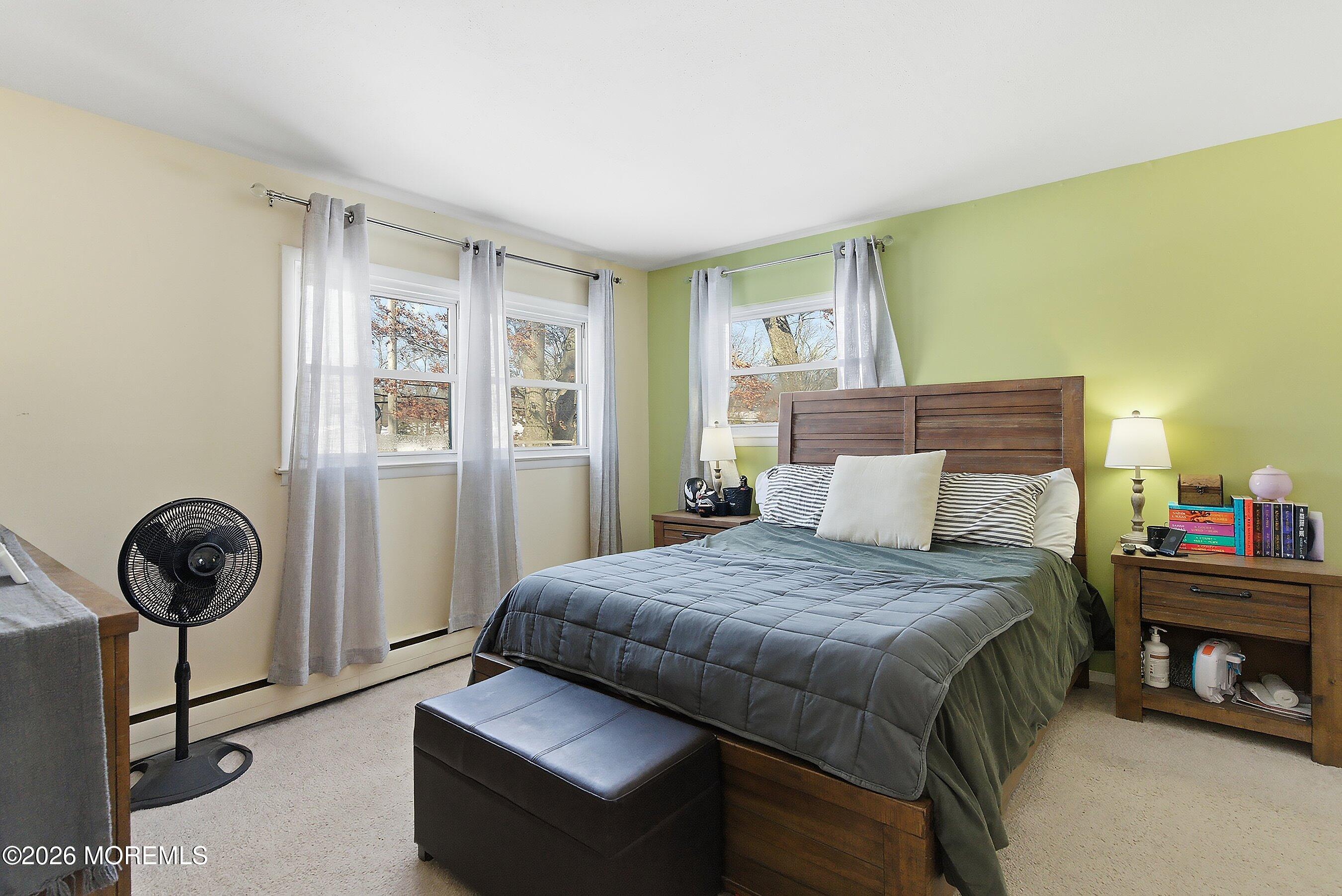70 Oak Ridge Parkway Toms River, NJ 08755 - Photo 15 of 34 a bedroom with a bed and a window