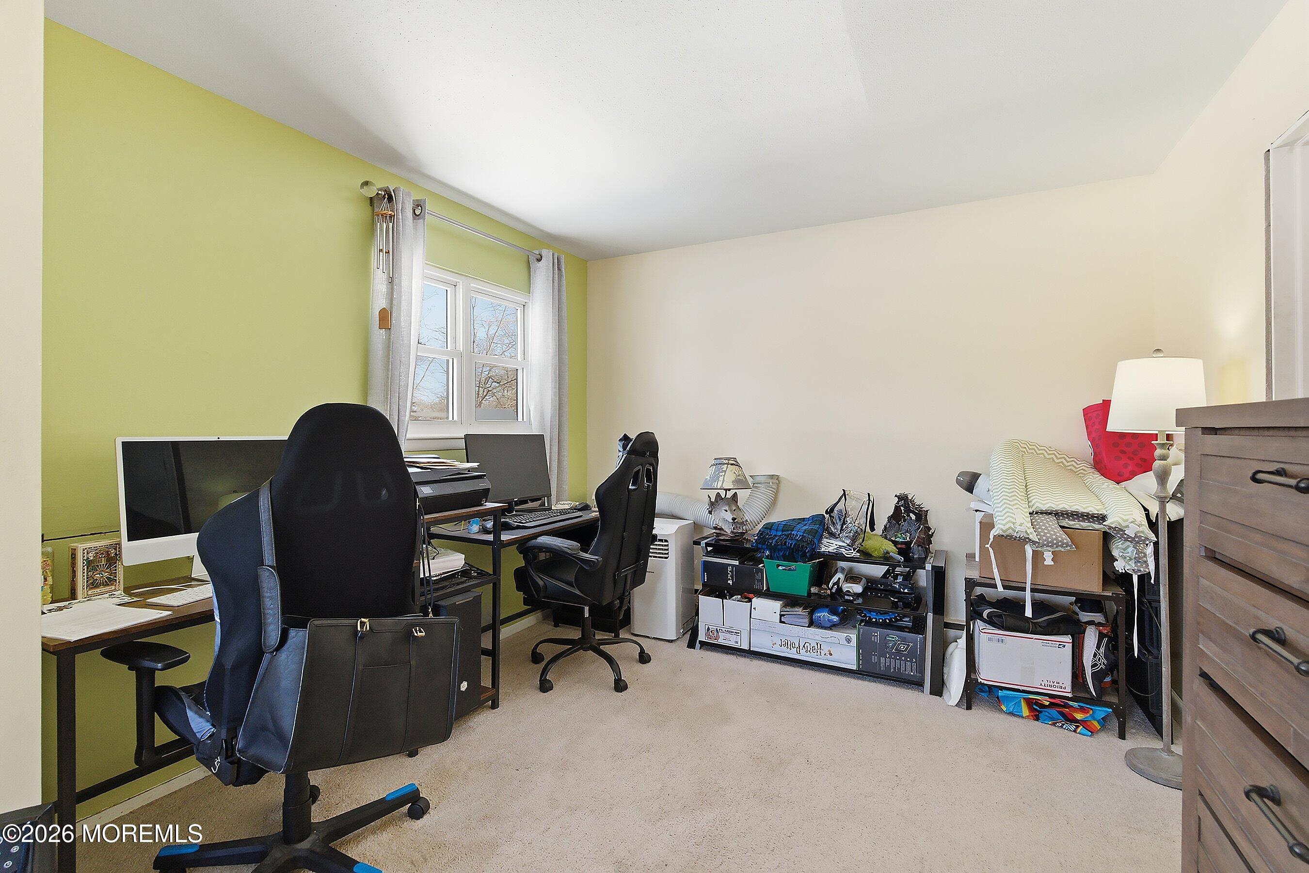 70 Oak Ridge Parkway Toms River, NJ 08755 - Photo 18 of 34 a view of a workspace with furniture and a window