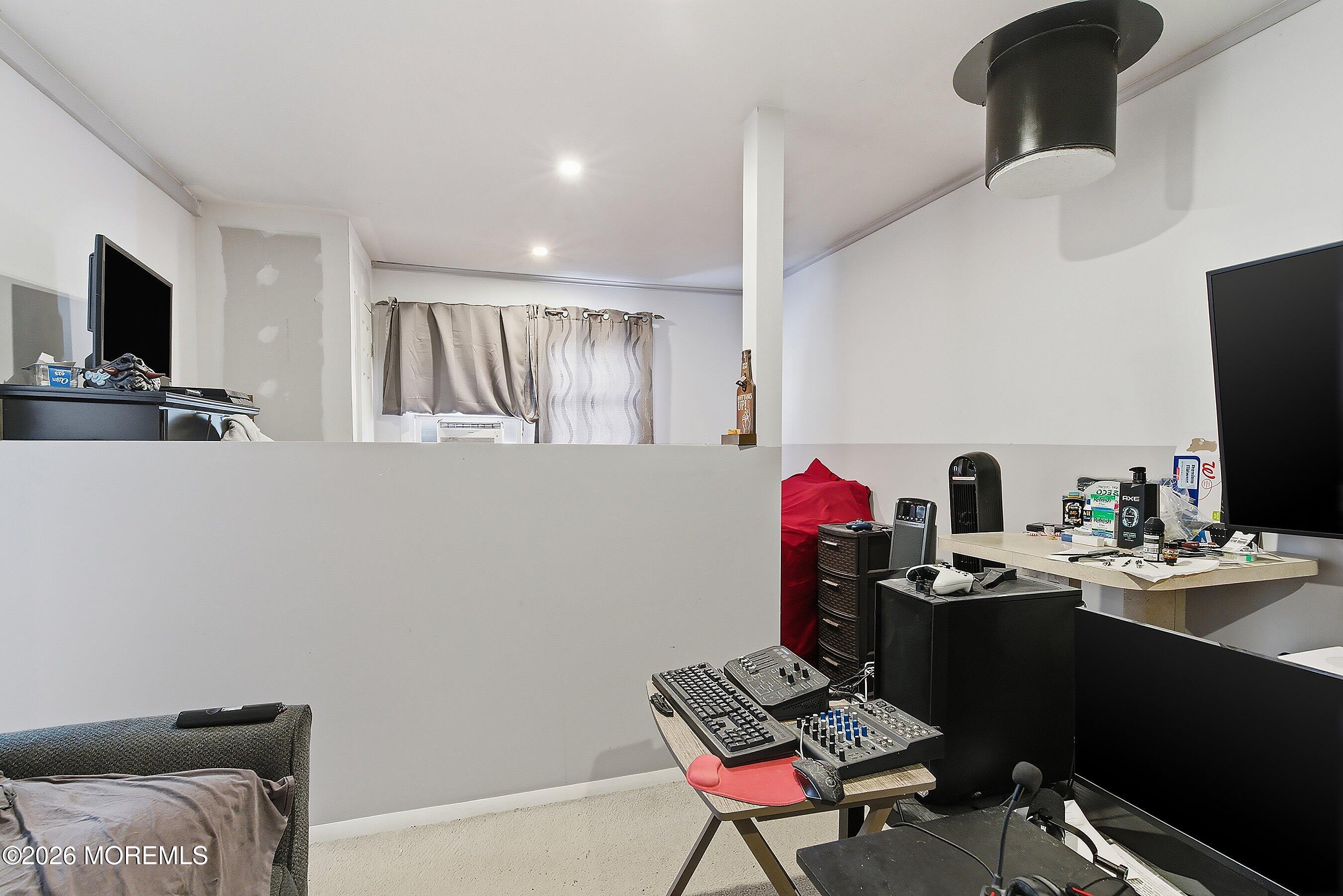 70 Oak Ridge Parkway Toms River, NJ 08755 - Photo 24 of 34 a living room with furniture and a flat screen tv