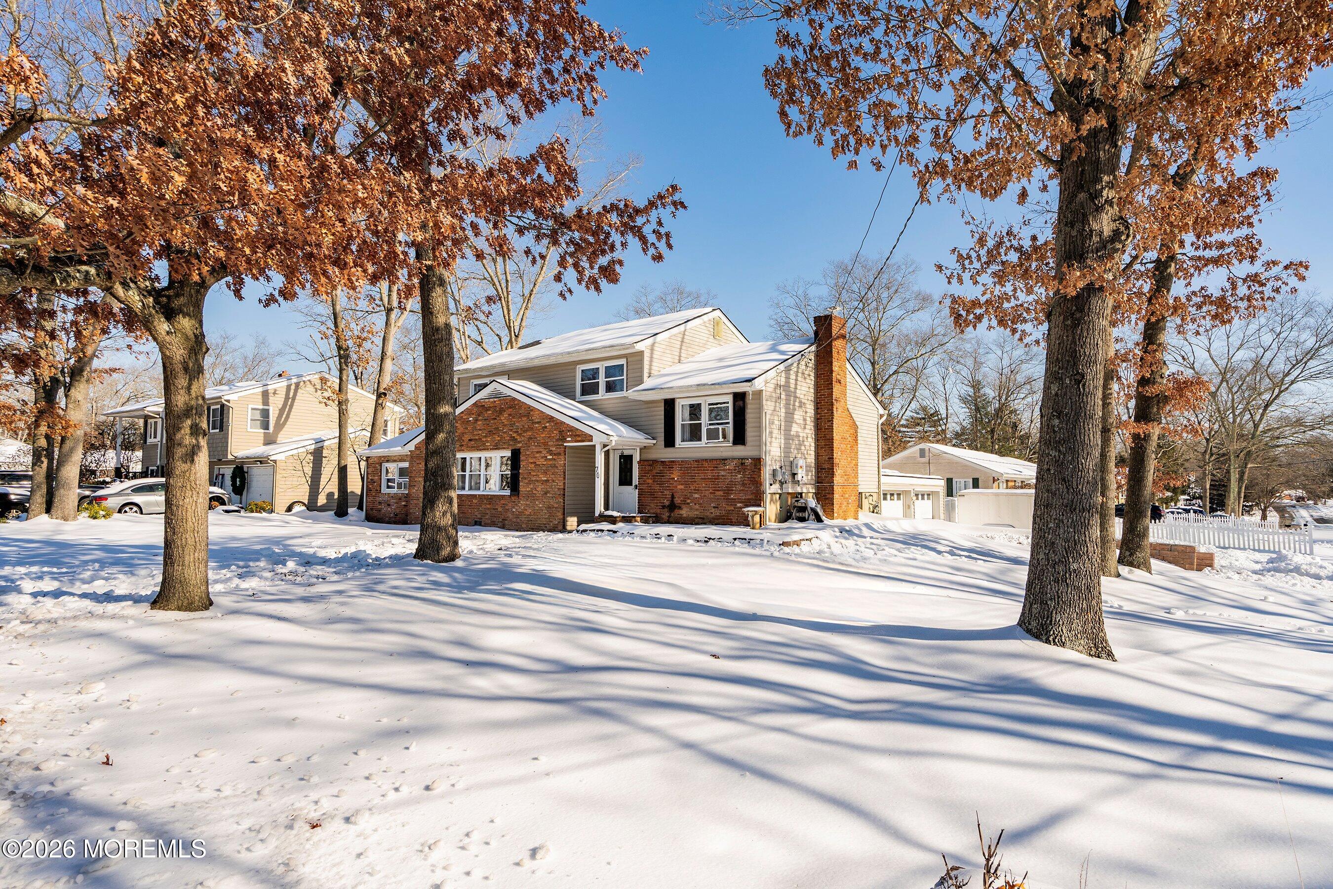 70 Oak Ridge Parkway Toms River, NJ 08755 - Photo 4 of 34 a front view of a building with street view