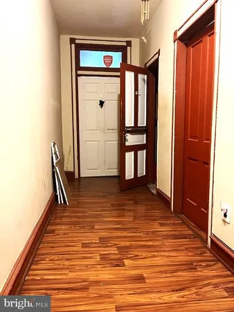 a bathroom with a toilet a sink and a window